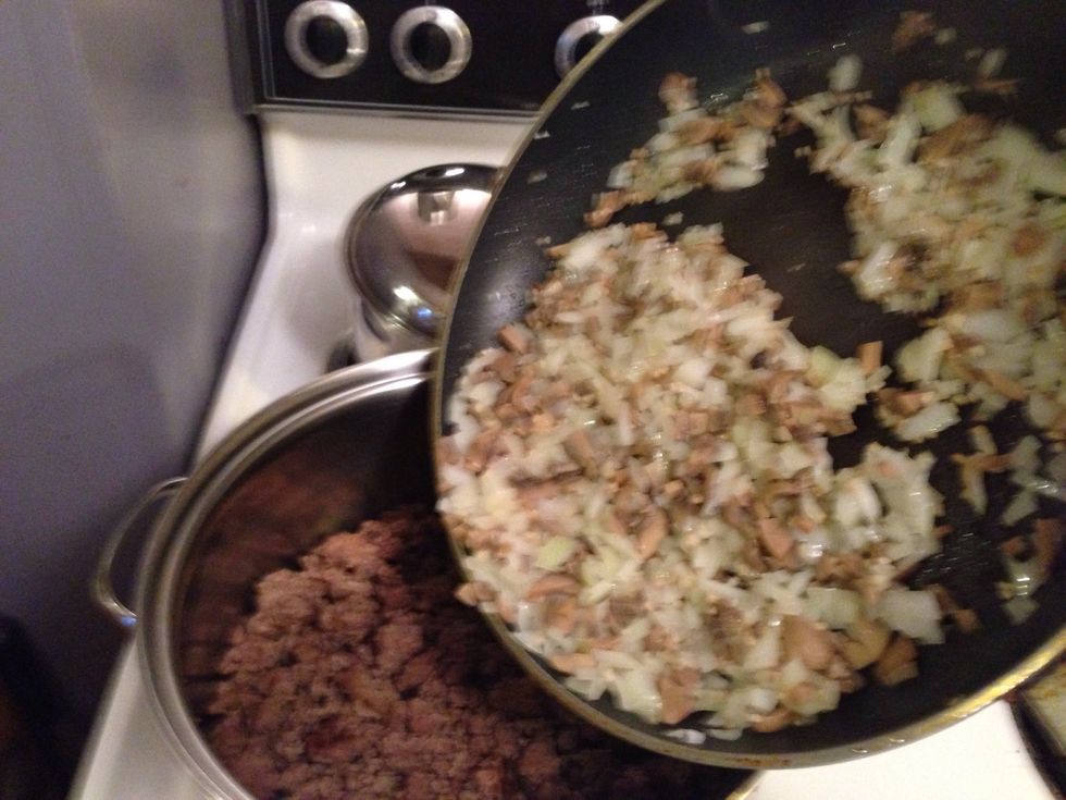 Add onions mushrooms and garlic to the meat.