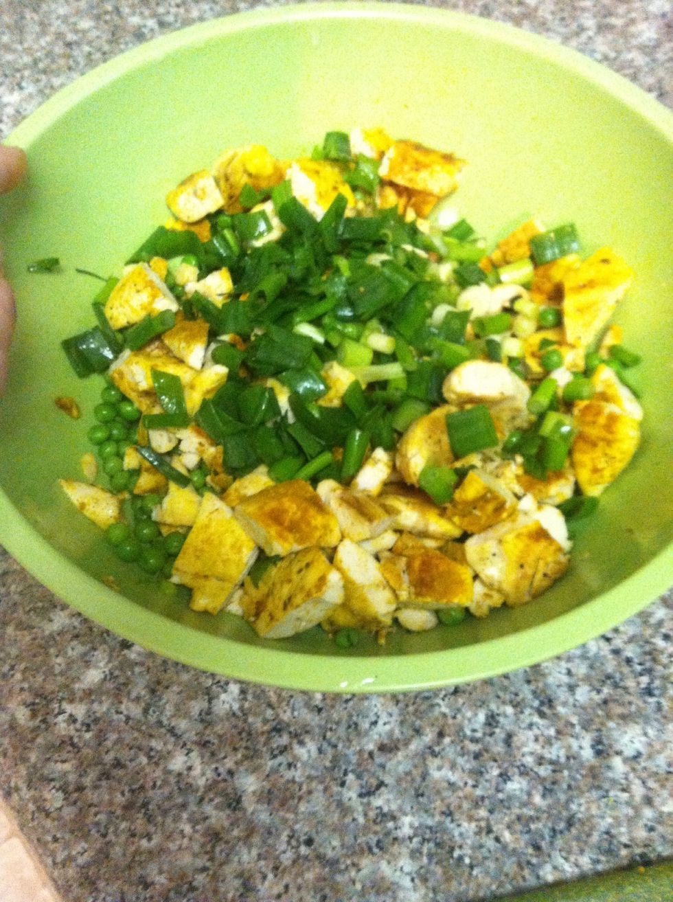 Add onions, peas, and chicken to a mixing bowl.