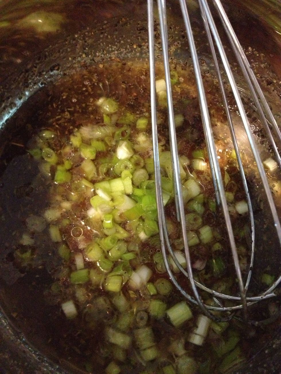 Add onions to dressing mixture and let sit for 1 minute.