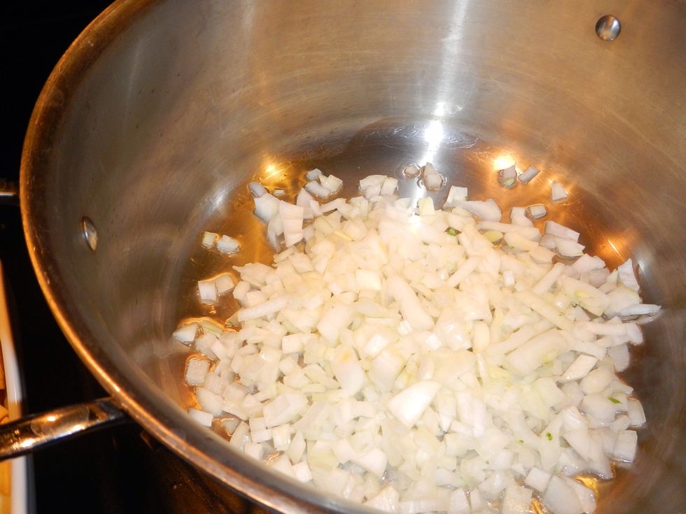 Add onions, we're looking to sweat the onions. Heat to low will just saut\u00e9, we need a little heat to put a quick brown on them!