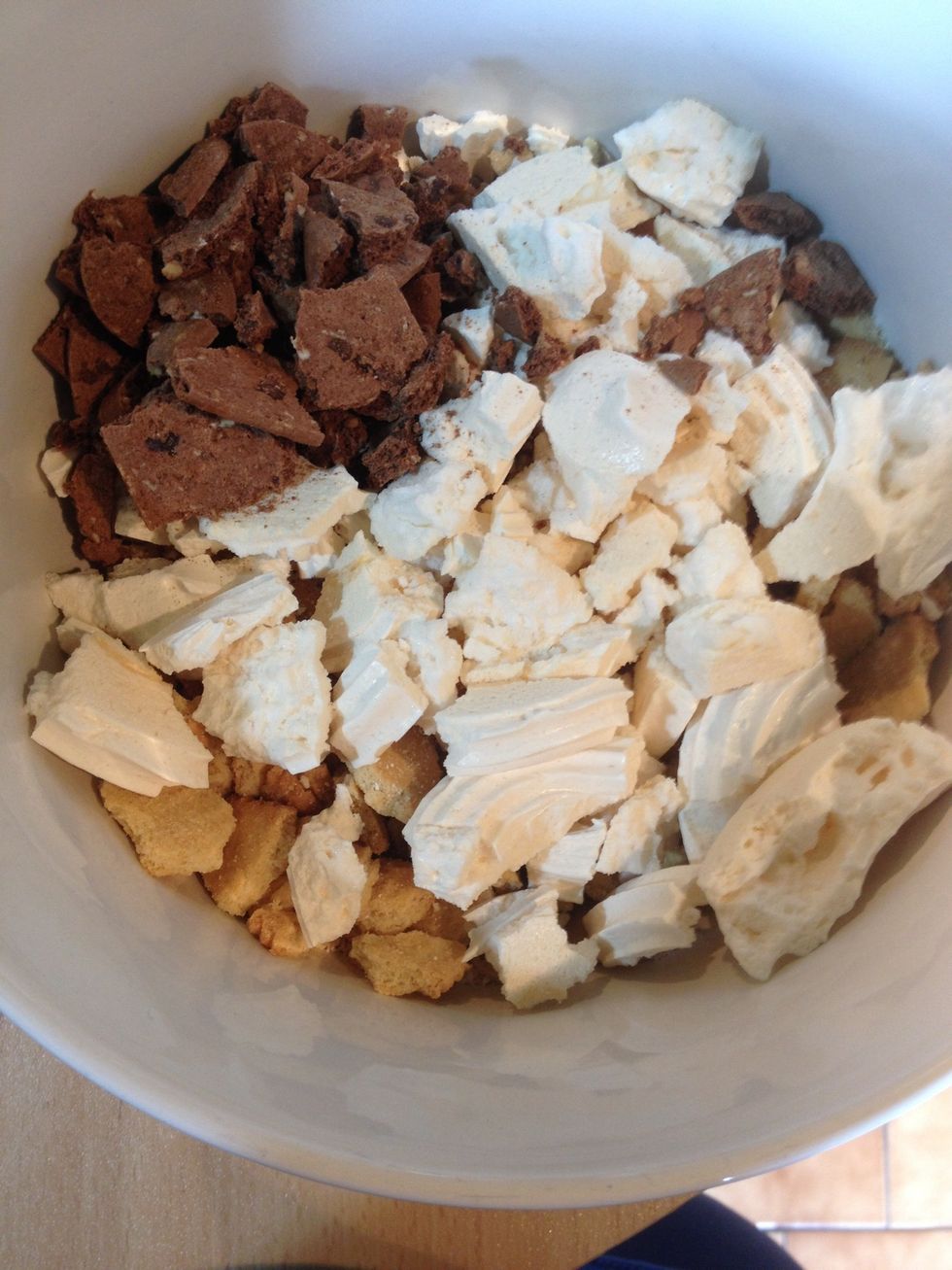 Add optional extras to the biscuits whilst the chocolate mix melts. I've used meringue and cookies. You could use nuts, dried fruit, choc chips, anything really.