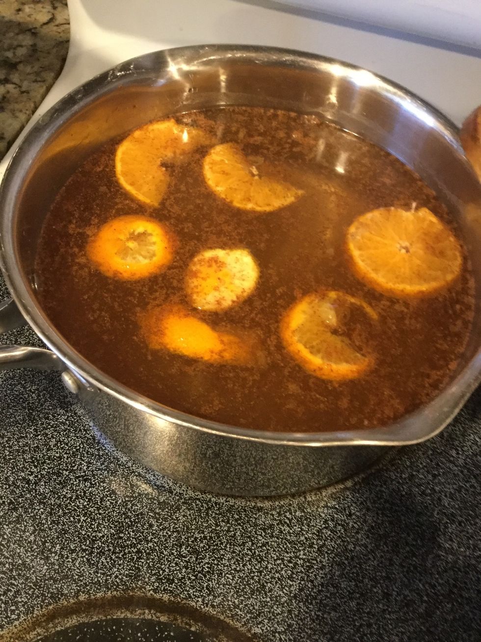 Add oranges. Btw, after tying this, DO NOT cut your orange slices in half like I did. Leave them as wholes. They separate and basically make a mess if you cut them in half. Well, lesson learned! \ud83d\ude02