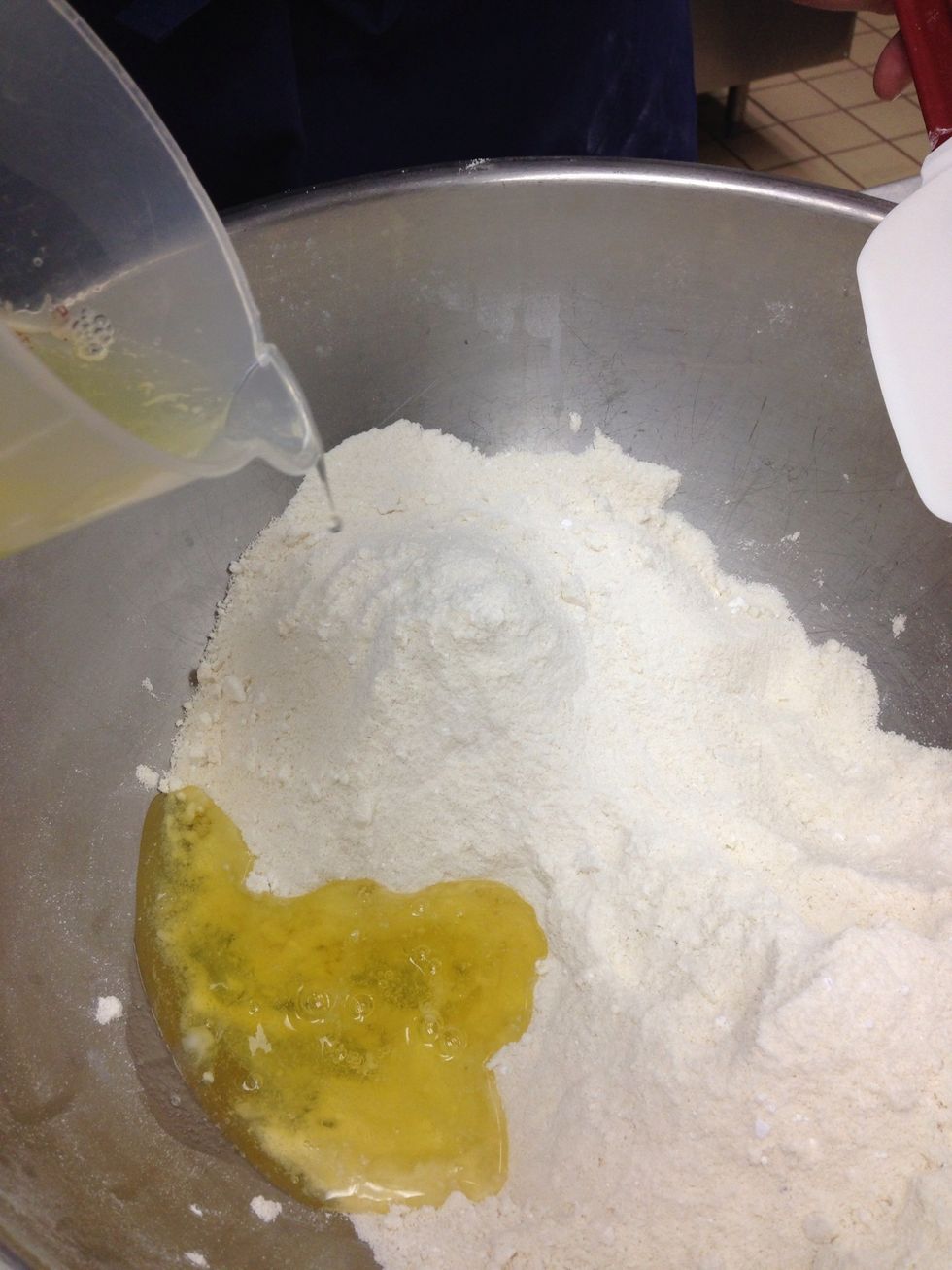 Add other egg white to almond flour/confectioners sugar mixture. Do not mix.
