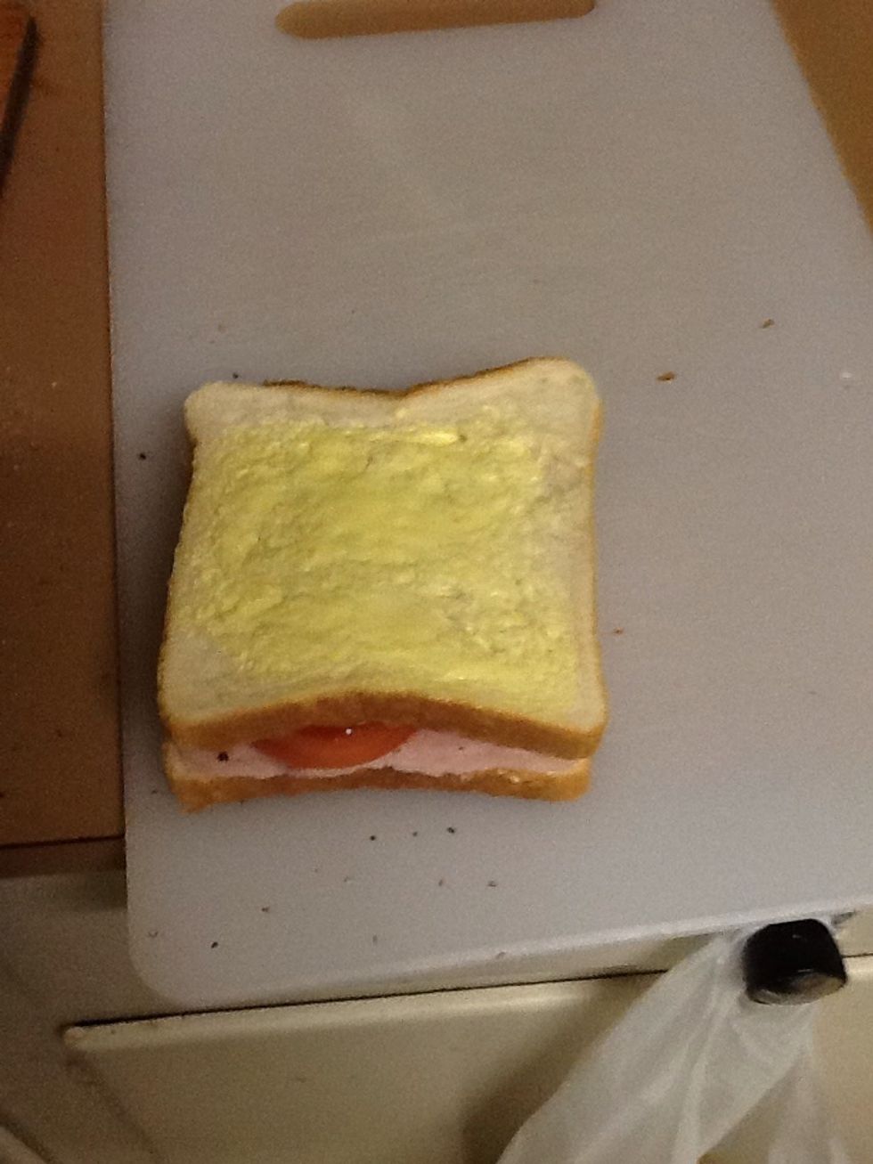 Add other slice of bread on top butter side up.