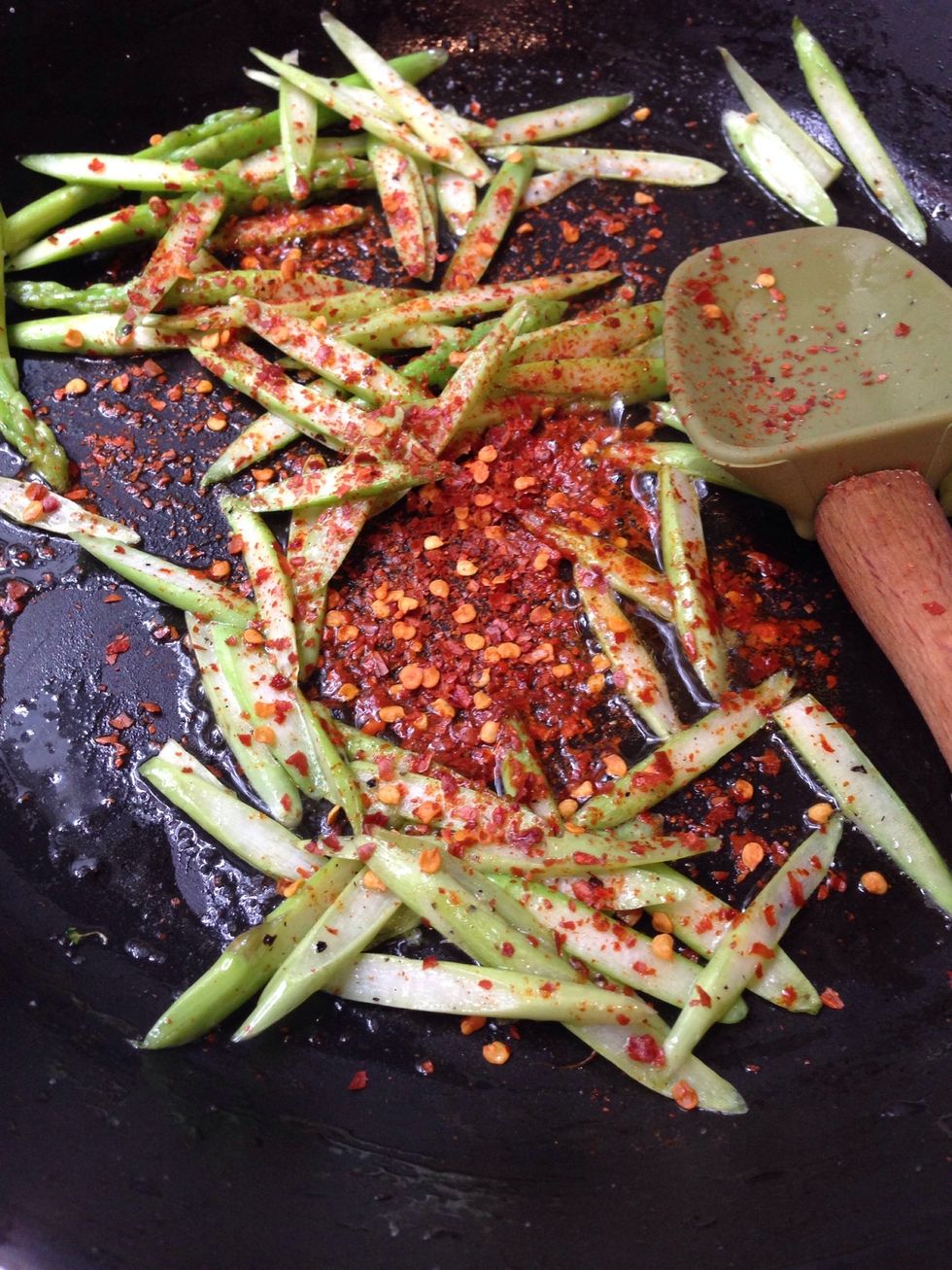 Add paprika or chili powder. Reduce the amount if you can't take spicy food and add if you could handle the fiery taste! Stir well under low heat.