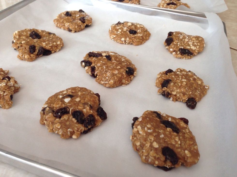 Add parchment paper to the pan and drop the cookie dough. Remember to flatten the dough. Bake at 350F for 10-15 min.