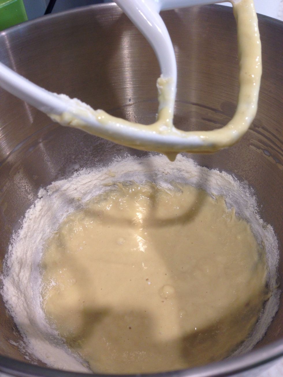 Add part of flour and mix