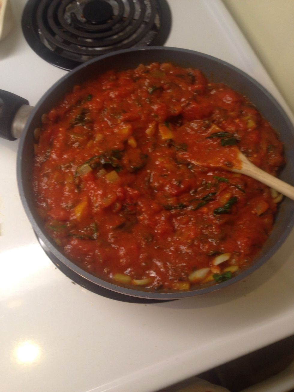 Add pasta sauce, garlic and pesto. Cook until hot.