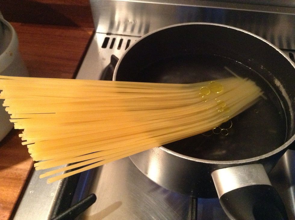Add pasta to boiling water with a tiny drop of oil
