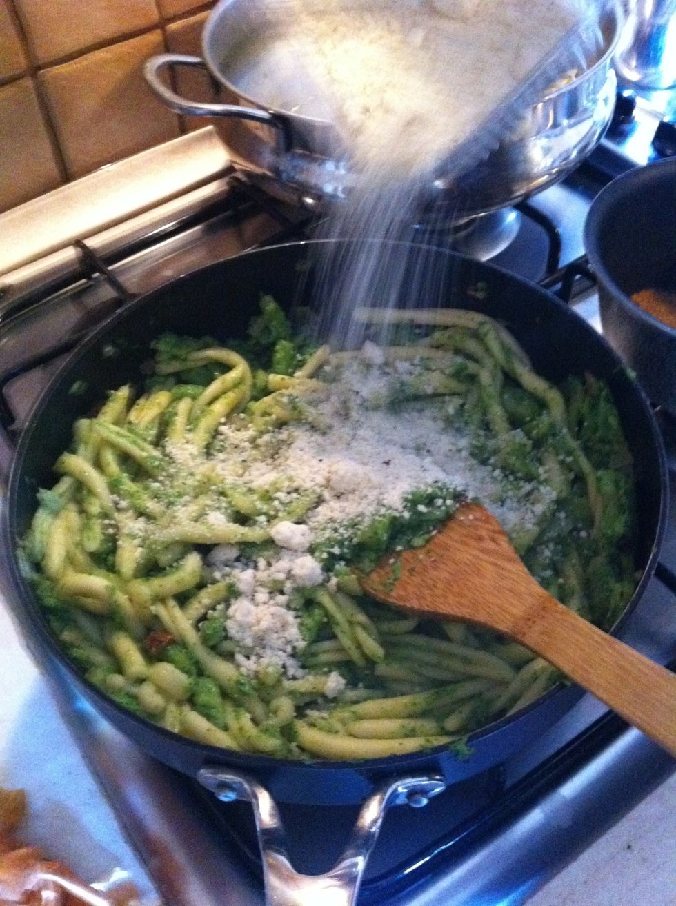 Add pasta to broccoli with some cup of its cooking water. Add grated 'pecorino' (sheep cheese) , cook for some minute stirring until texture of the sauce is creamy.