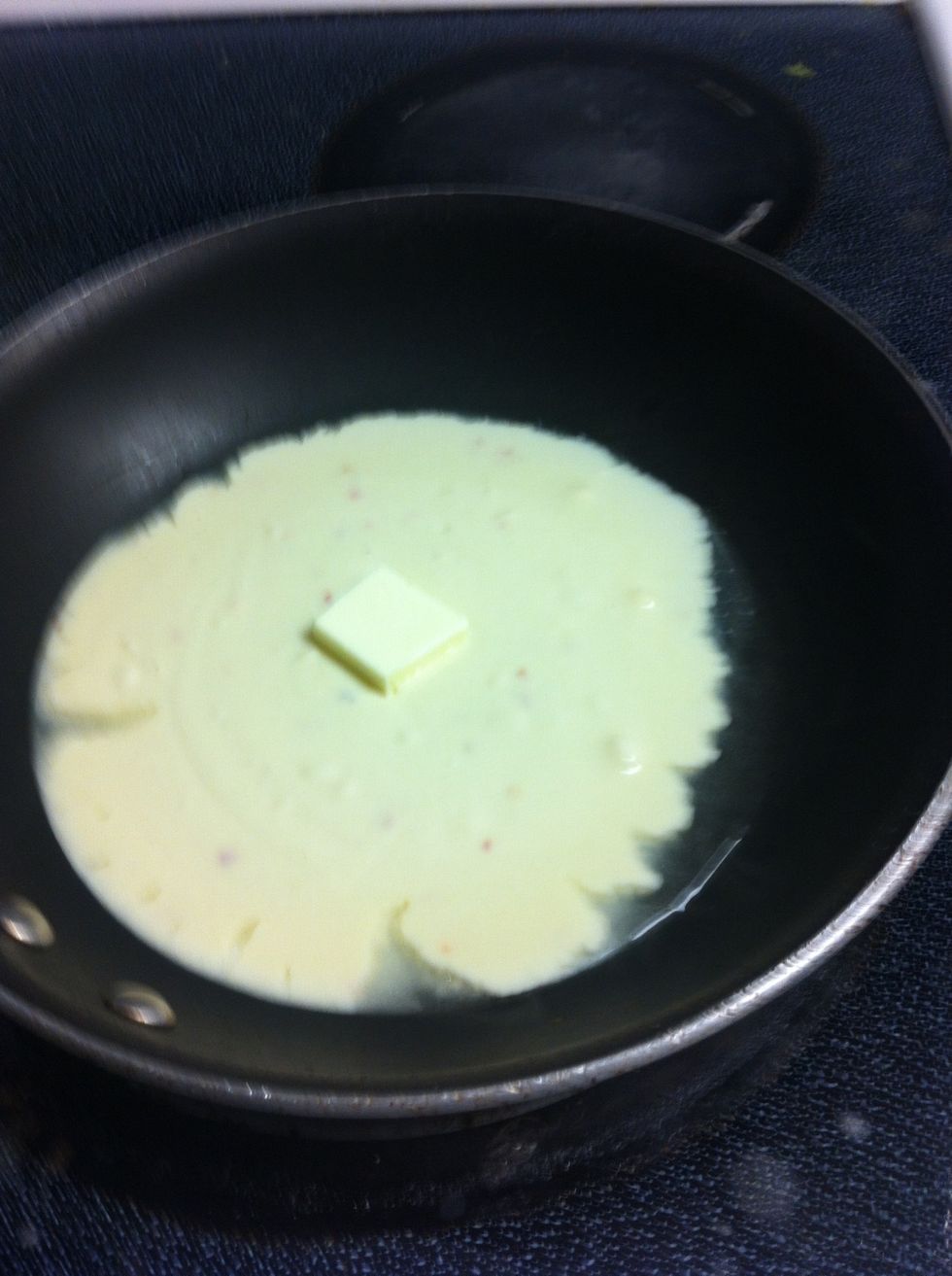 Add pat of butter to melted Cheese Sauce.
