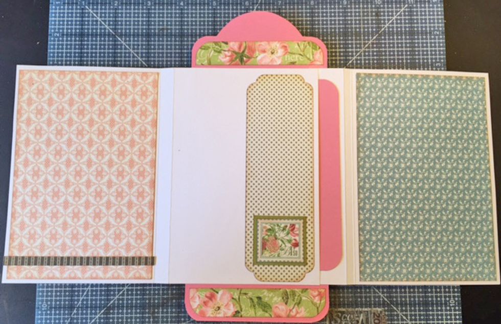 Add patterned paper and embellishments to inside flaps/pages.