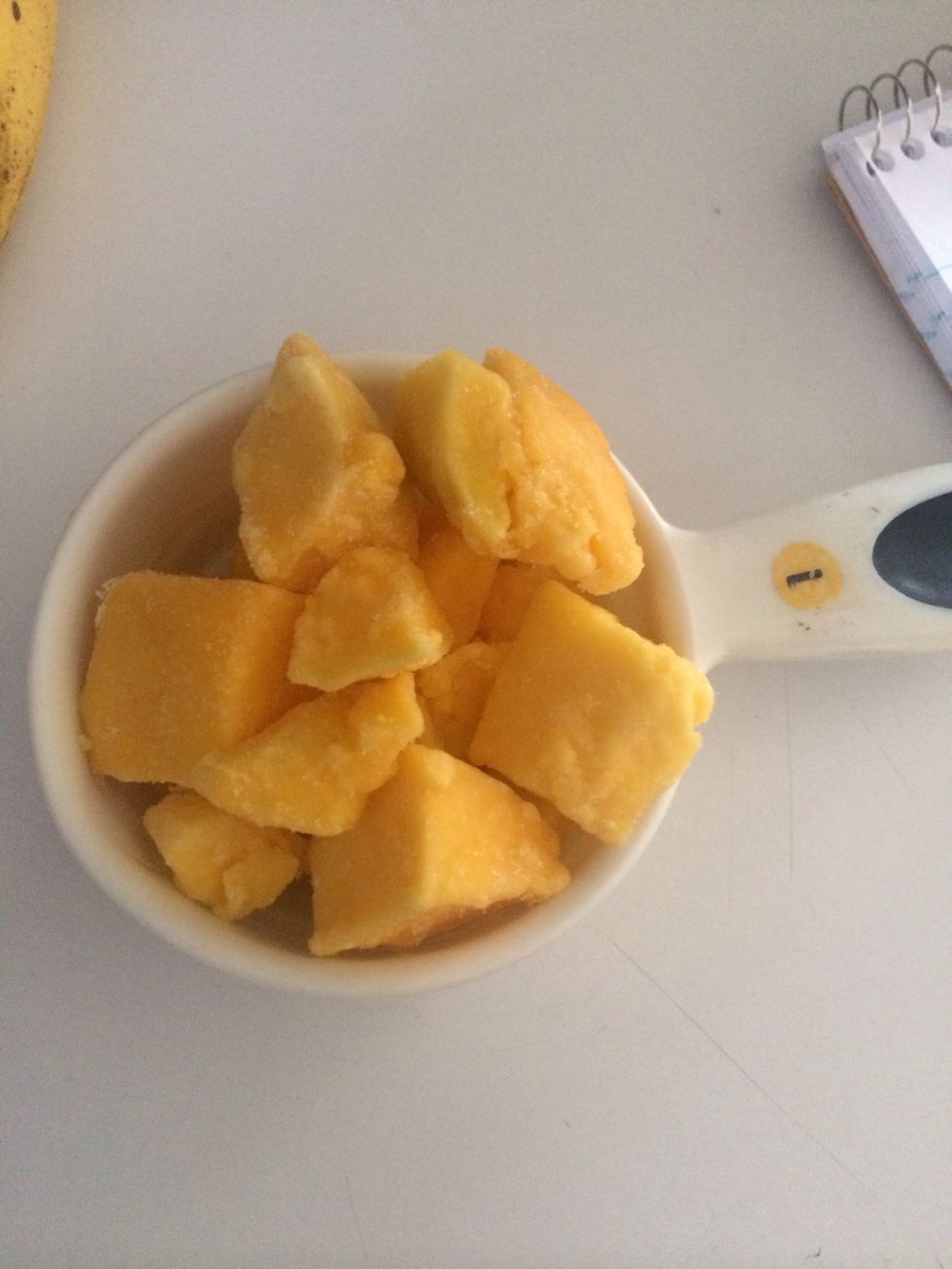 Add peaches and mangos into blender