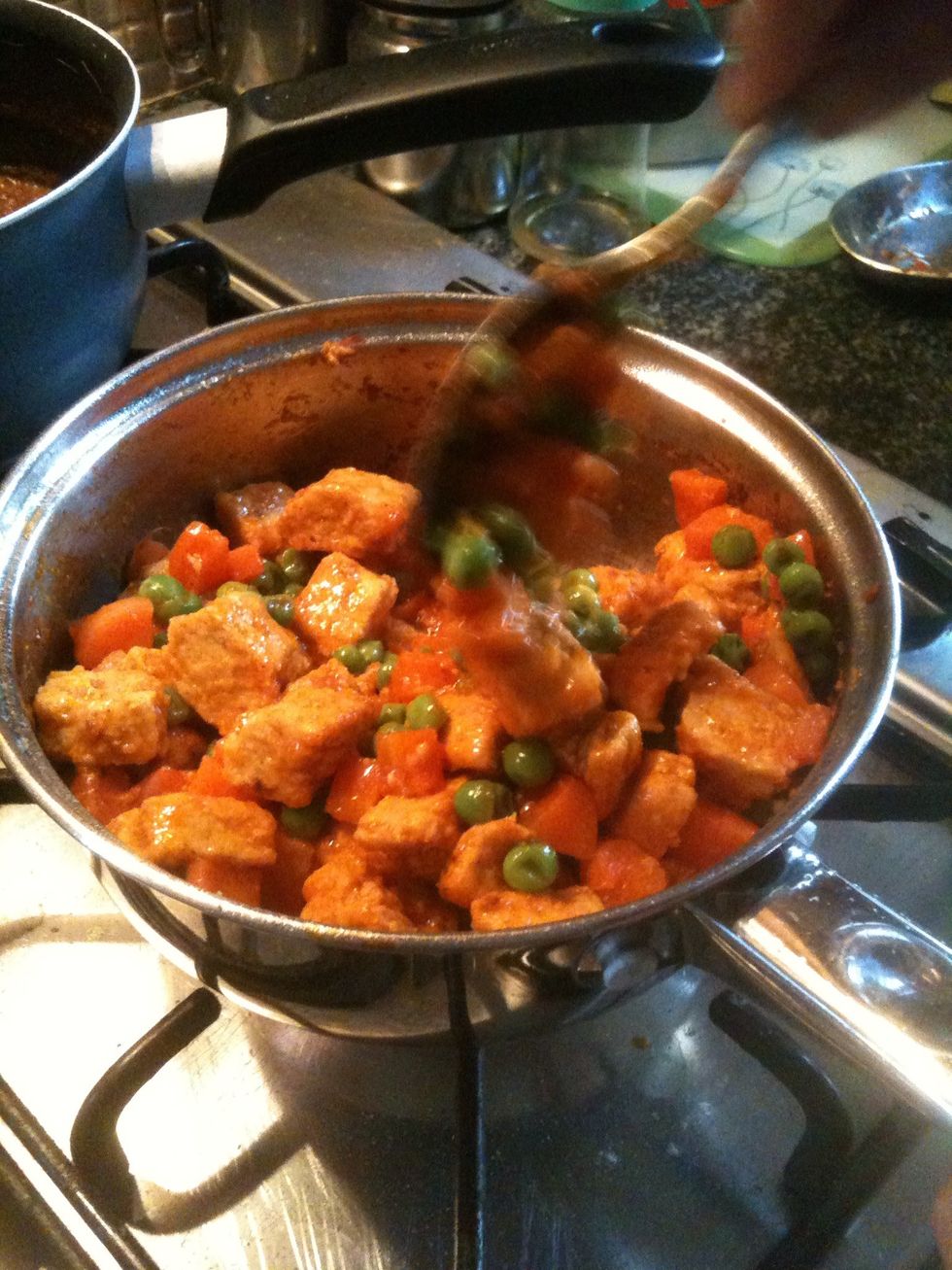 Add peas and chopped carrots to the mixture and add some water and let it soften.