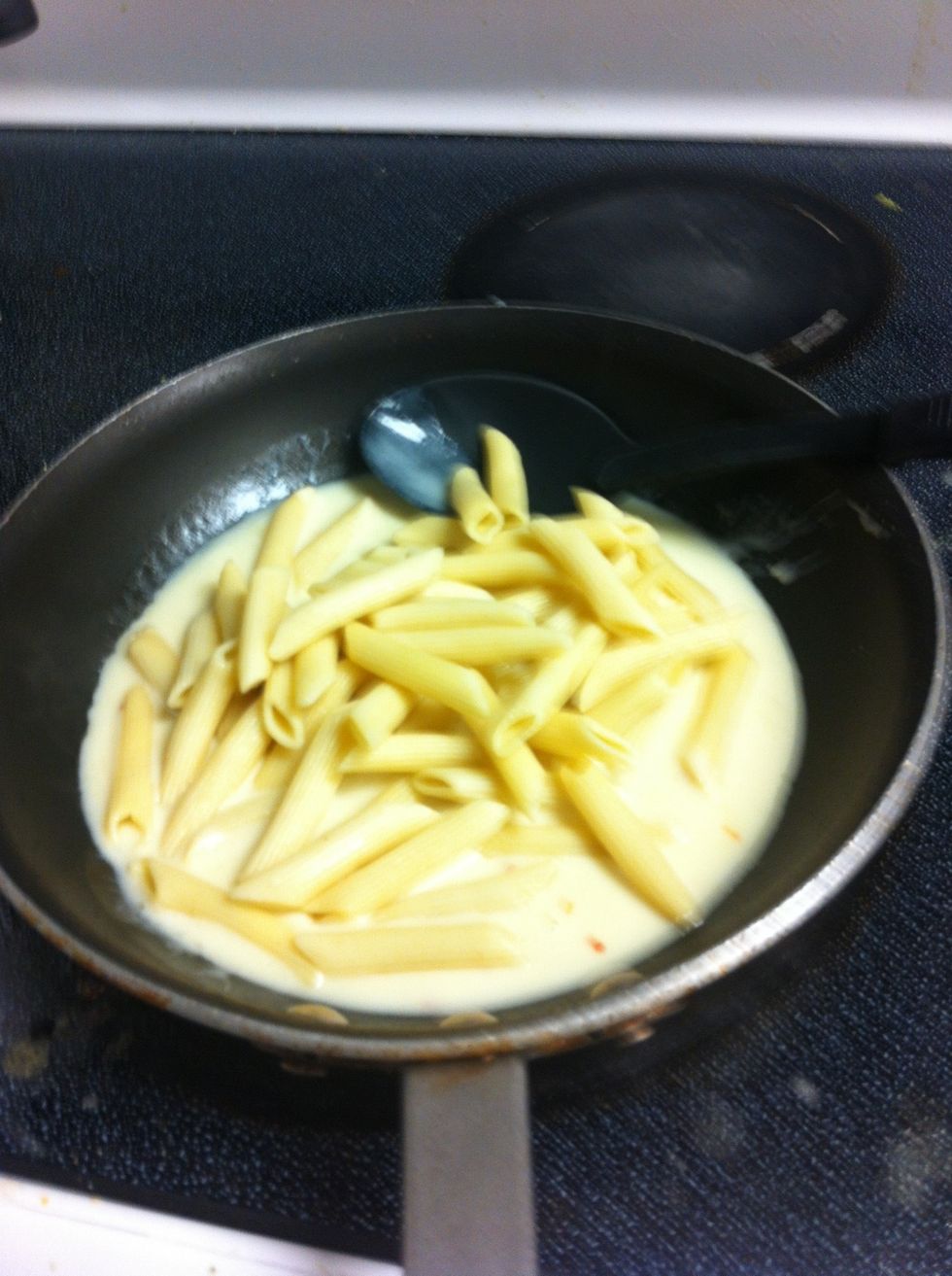 Add Penne to pan and fold into mixture coating Penne thoroughly and evenly.