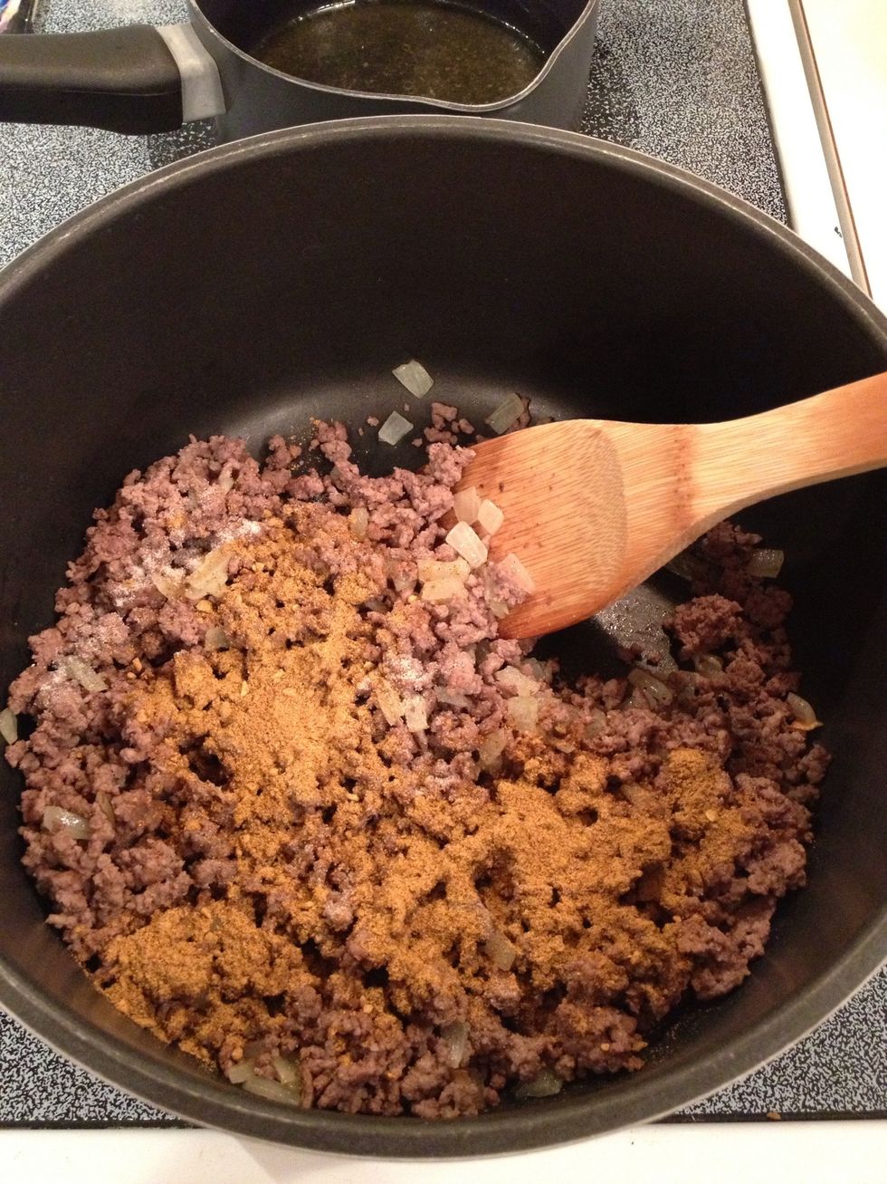 Add pepper, garlic powder, and chili seasoning.  Stir well.