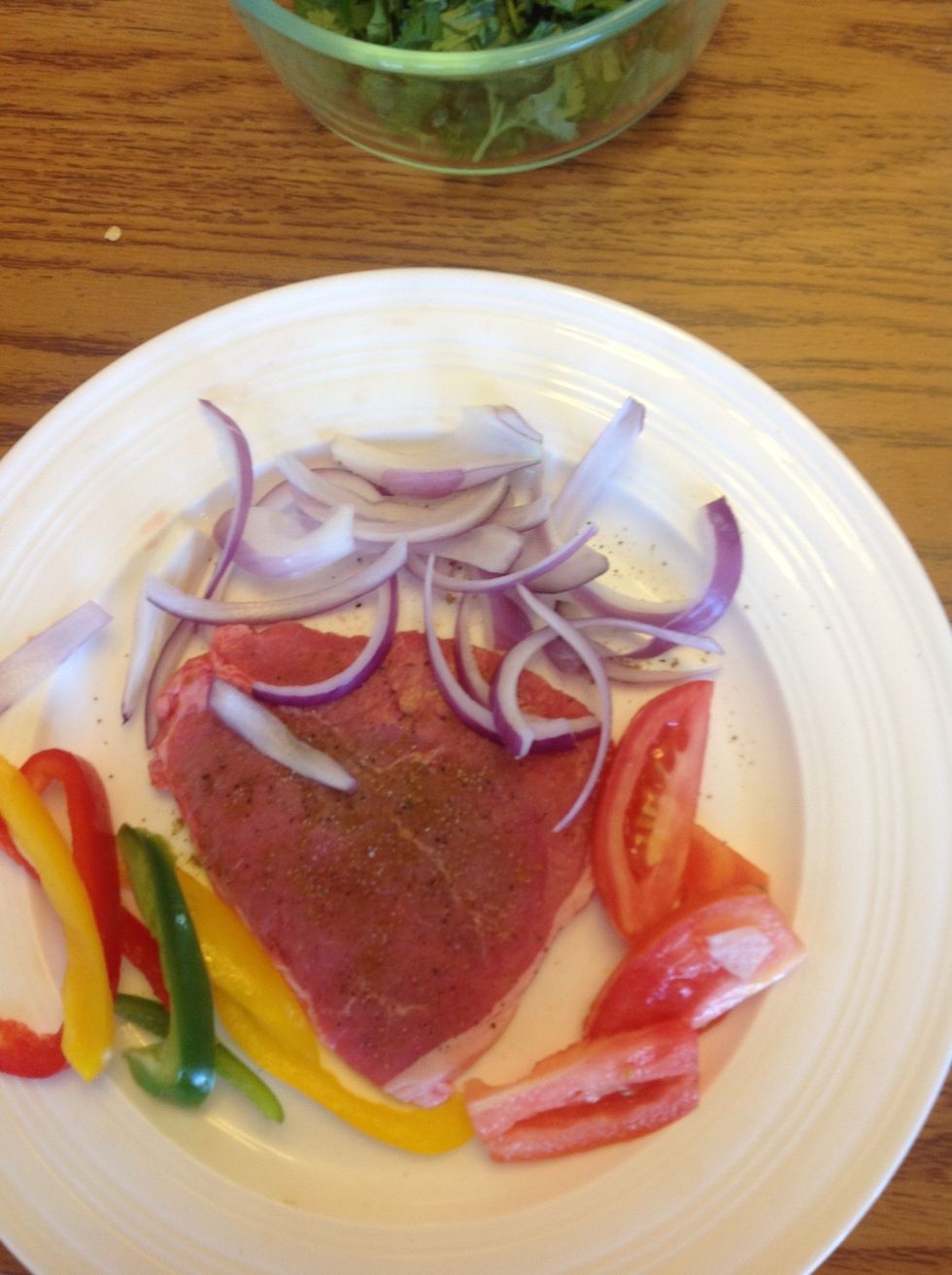 Add pepper onion and tomatoes to the side