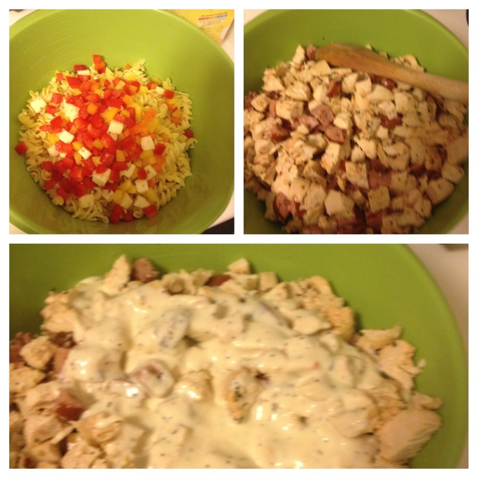 Add peppers and cheese to pasta, then chicken and sausage and finally add the creamy sauce