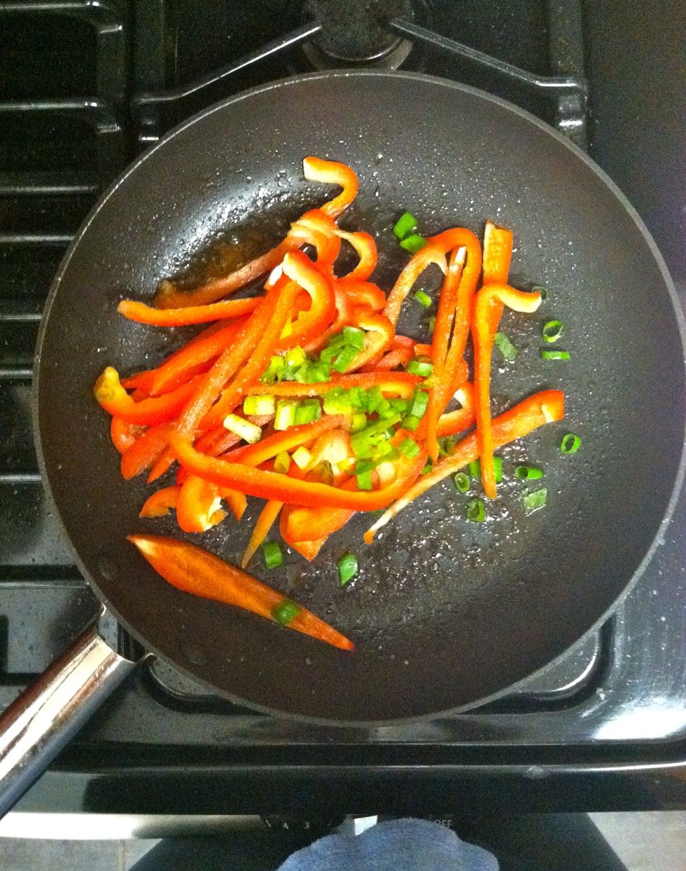 Add peppers, shallot, and 1/4 teaspoon each salt and pepper to the drippings in the skillet. Cook, tossing frequently, until beginning to soften, 3-5 minutes.