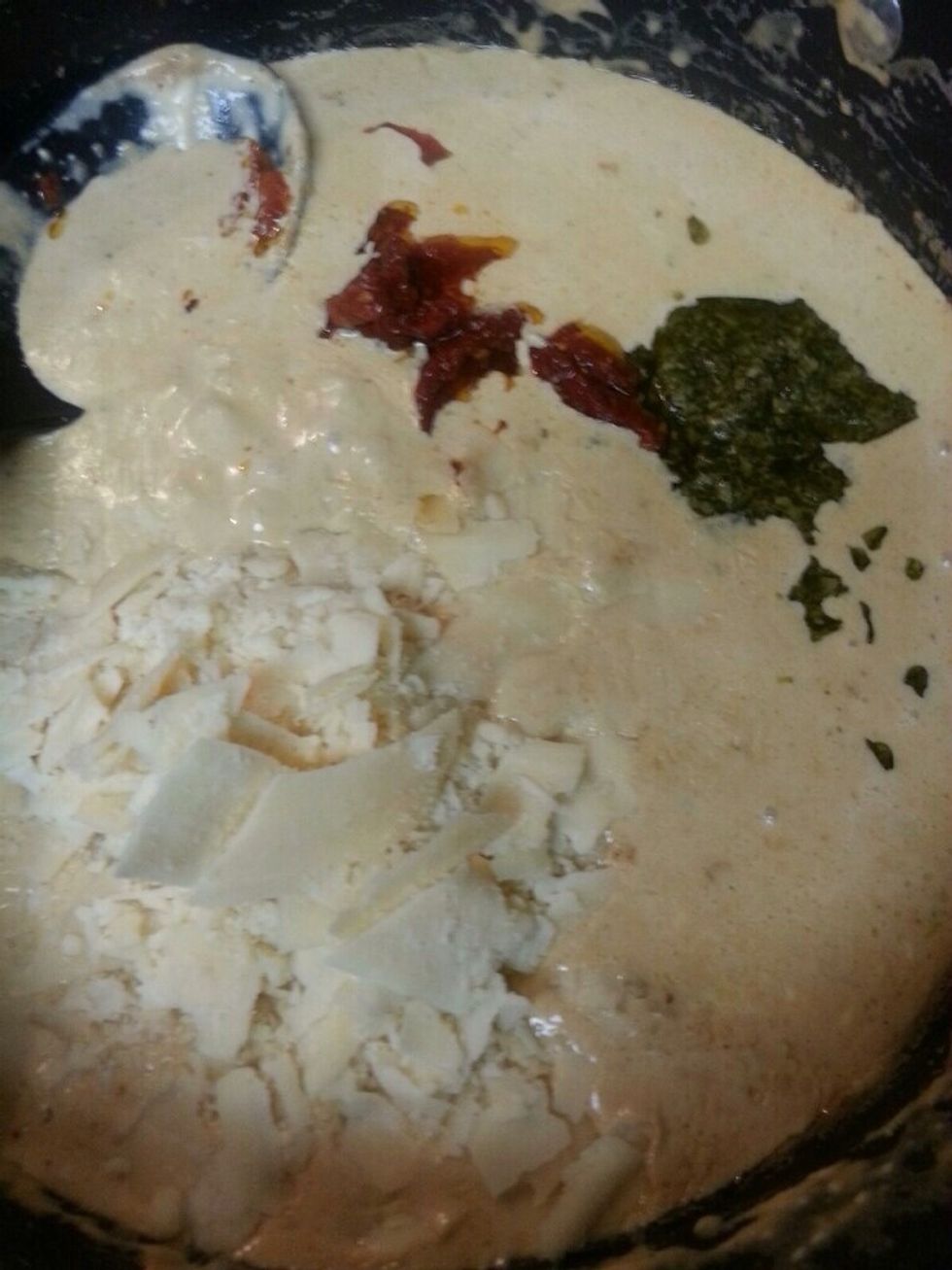 Add Pesto, sun dry tomatoes and parmesan cheese