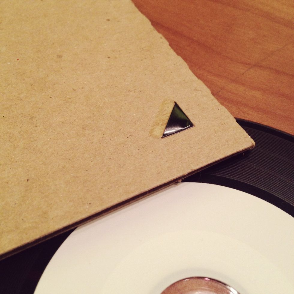 Add photo corners to the front of the CD sleeve. No need for glue, these come with adhesive! Just peel off the paper and carefully stick them on. Insert photo and you're ready to go!