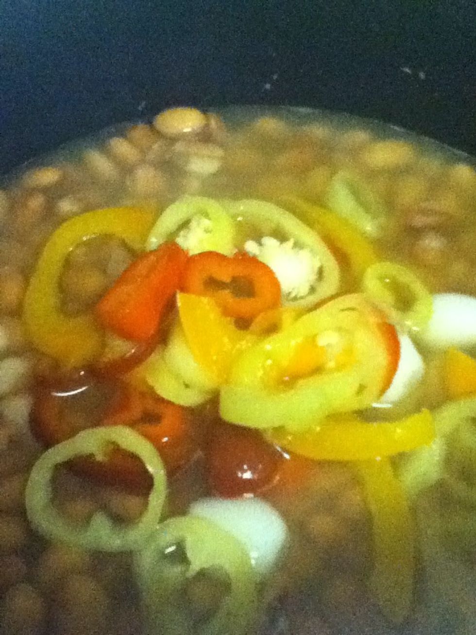 Add pickled peppers and some pickled onion. Warm through.