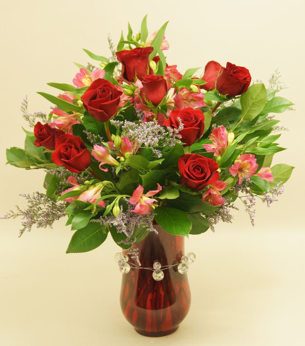 Add pink alstroemeria to finish the design.