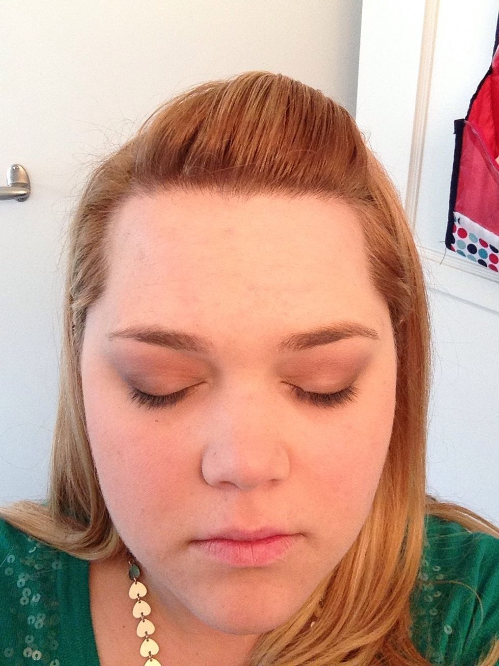Add plum eye shadow to the part of your lid between the crease and they eyebrow. Don't go all the way up to the eyebrow.