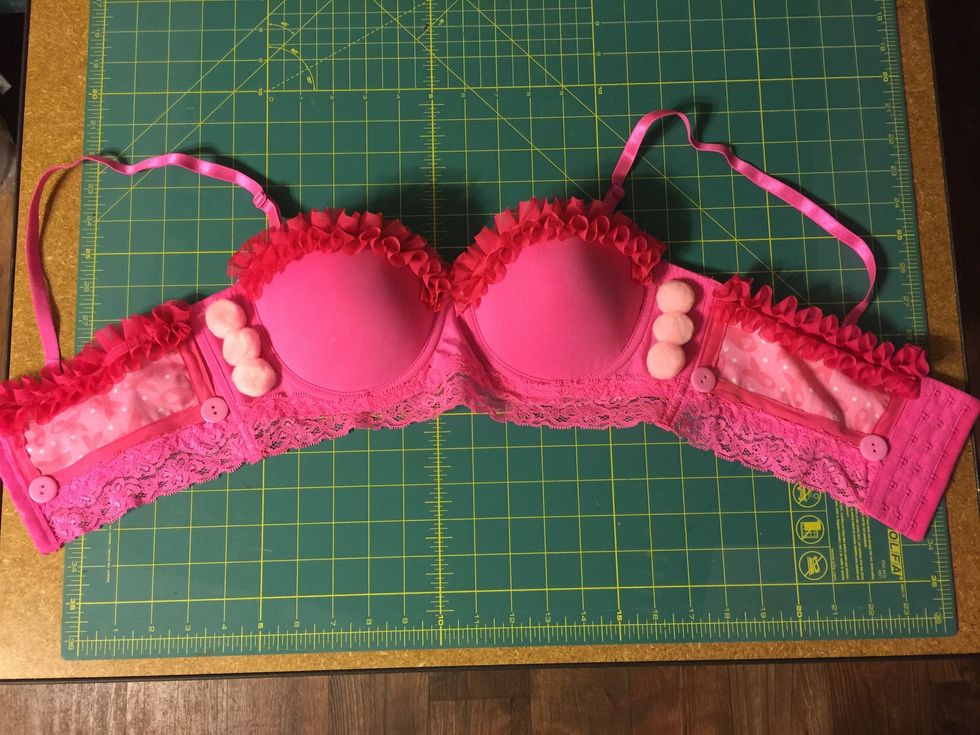 Add poms and buttons with E6000 adhesive in whatever design suits you.