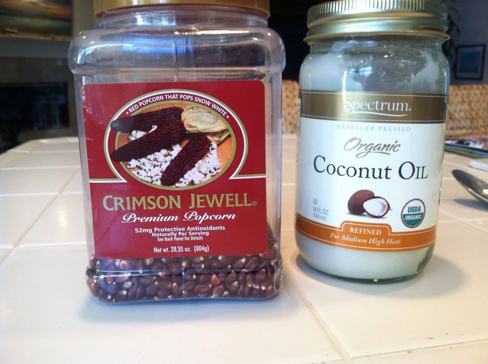 Add popcorn and coconut oil to medium saucepan