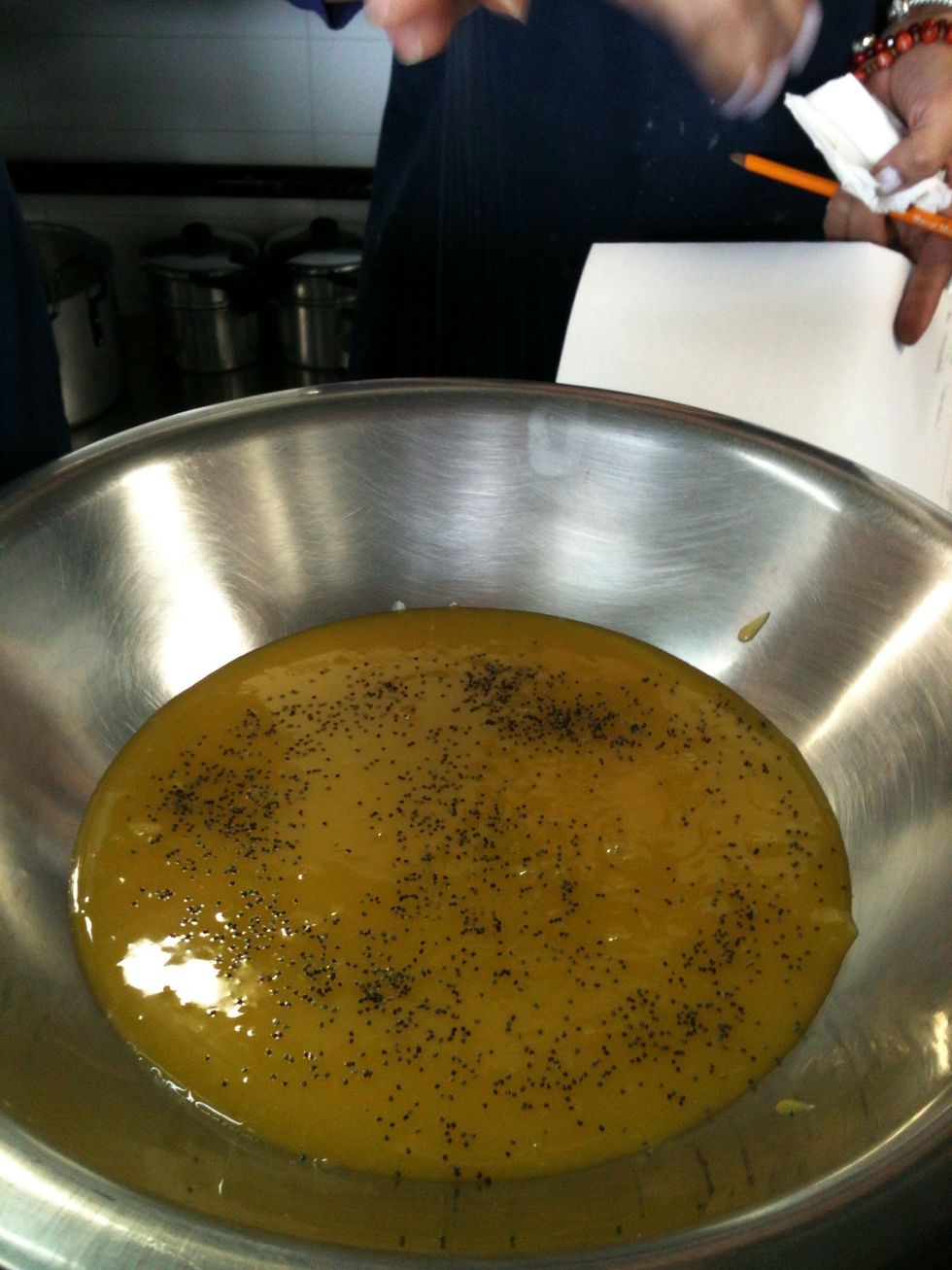 Add poppy seeds to simulate the passion fruit seeds
