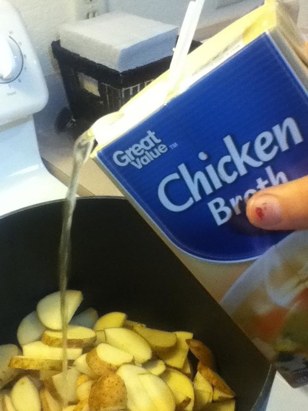 Add potatoes and chicken broth to a large soup pot. Turn heat up just enough to boil potatoes. Keep a lid on so the broth doesn't evaporate.