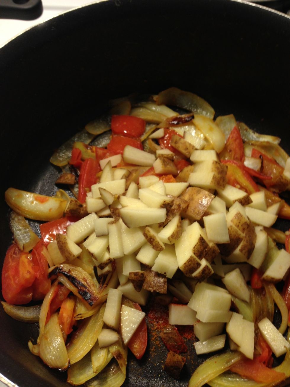 Add potatoes and stir for a minute and wait one more minute. Then turn heat to high.
