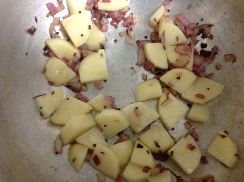 Add potatoes till half cooked. Add a little salt