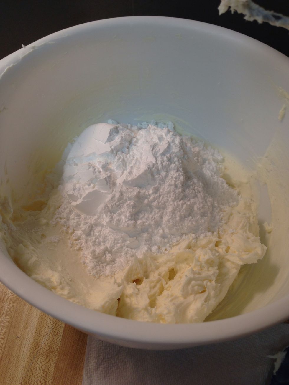 Add powdered sugar, 1 cup at a time until smooth.