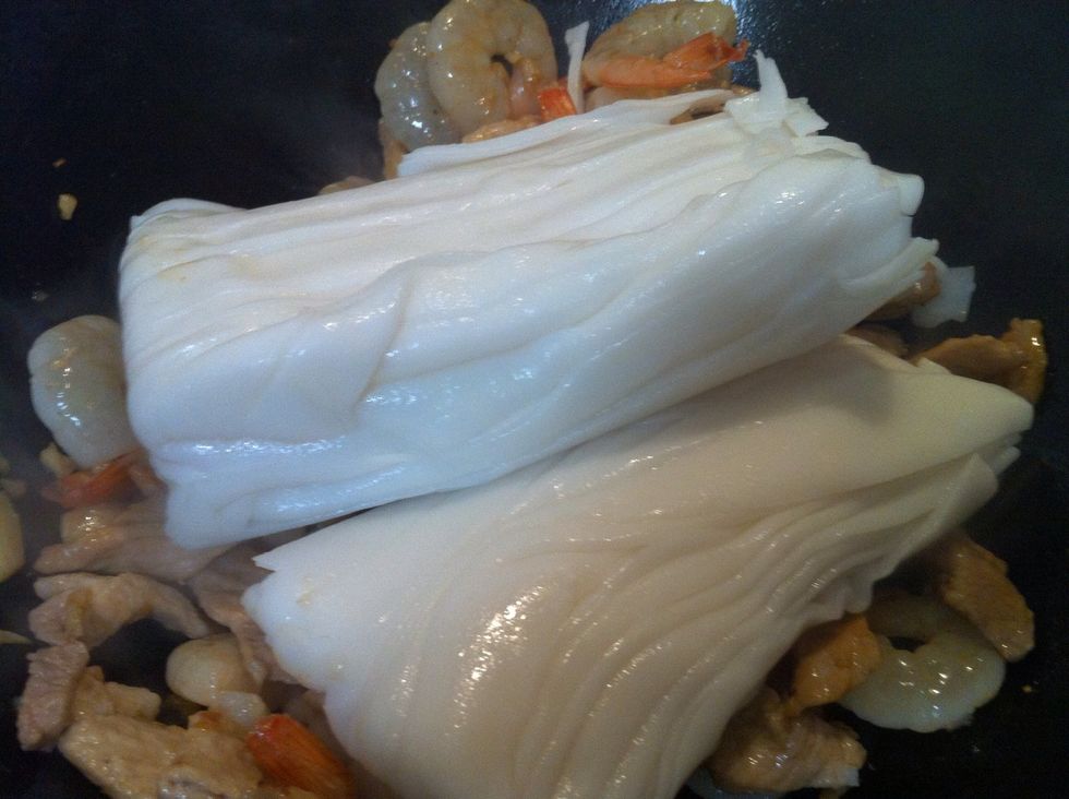 Add prawns a cook for a minute. Add the fresh noodles.