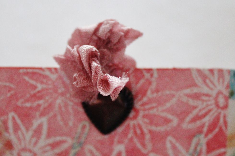 Add pretty pink bow and heart brad to top of tag.