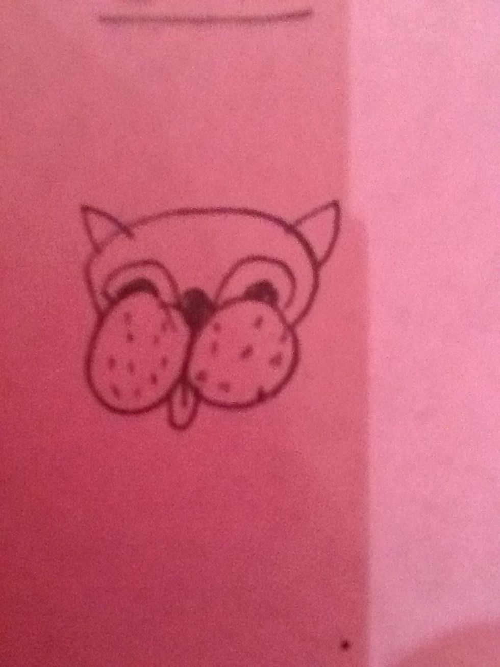 Add pupils, ears and a tongue