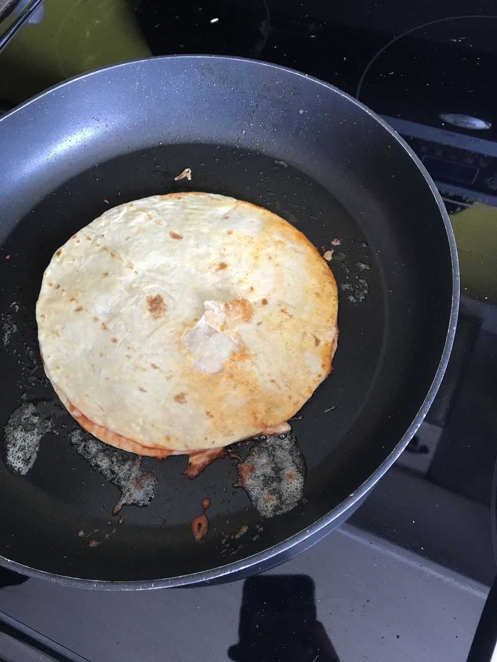 Add quesadilla and, cook on both sides until golden brown