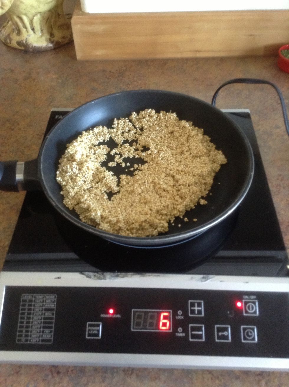 Add quinoa to skillet.