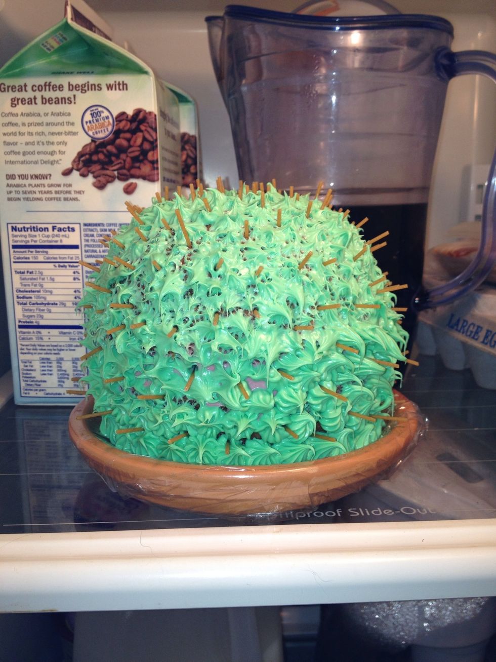 Add raw spagehtti noodles into cake for spikes.