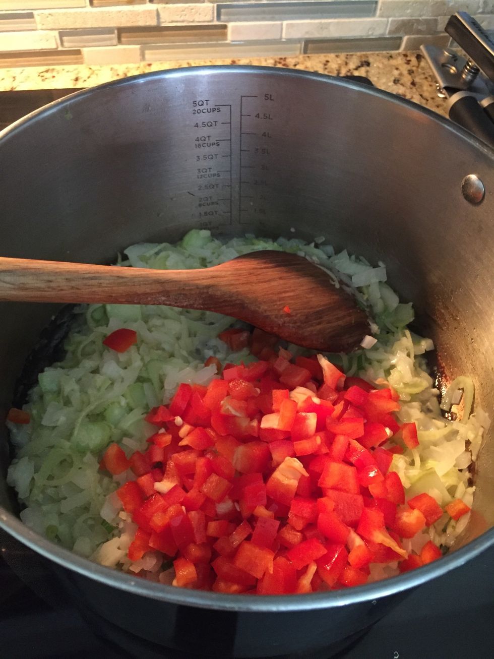 Add red bell pepper and brown