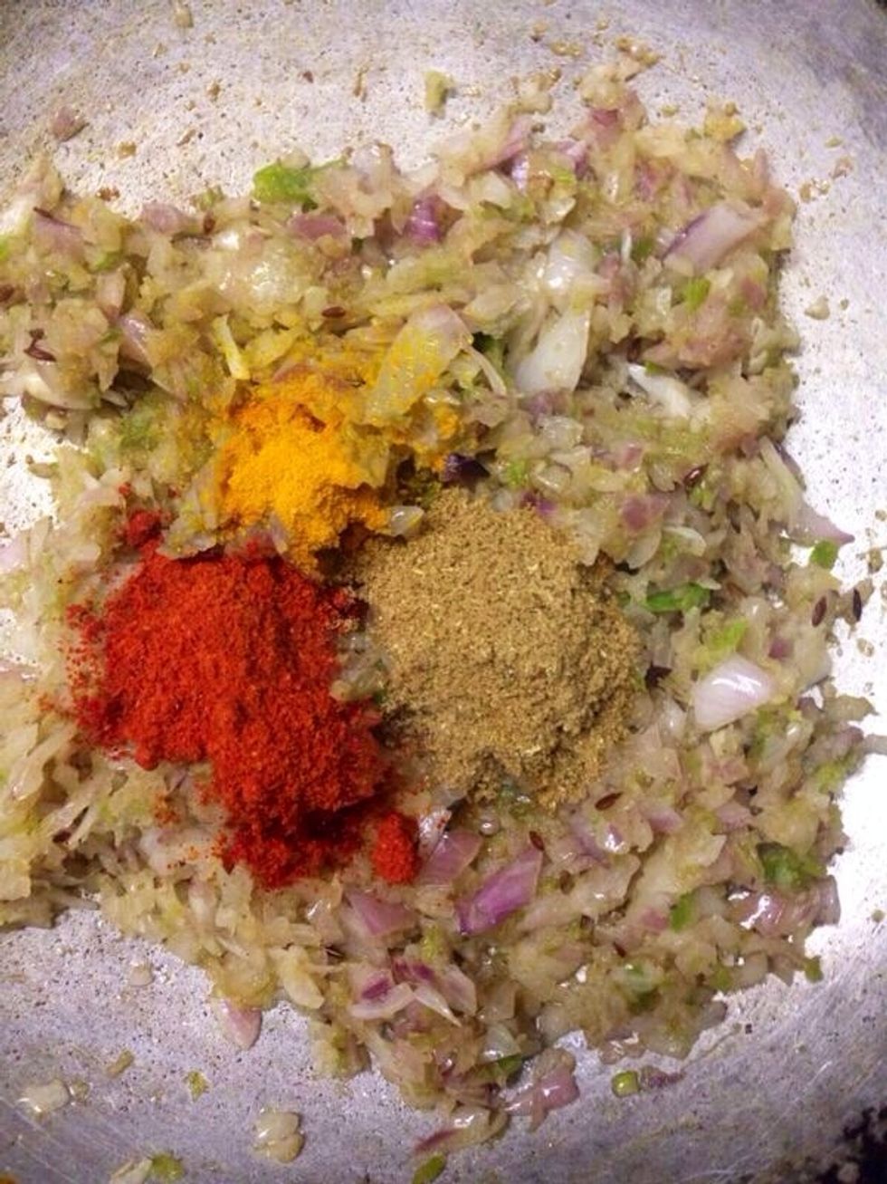 Add red chilli powder, turmeric and coriander powder. Stir well and cook for a minute.