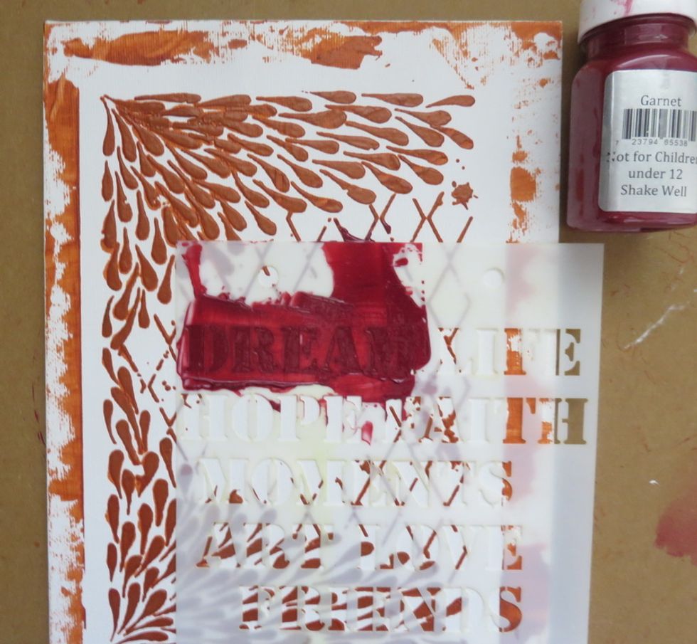 Add red paint (I used Garnet and this color is retired) over Soliloguy stencil word " Dream".