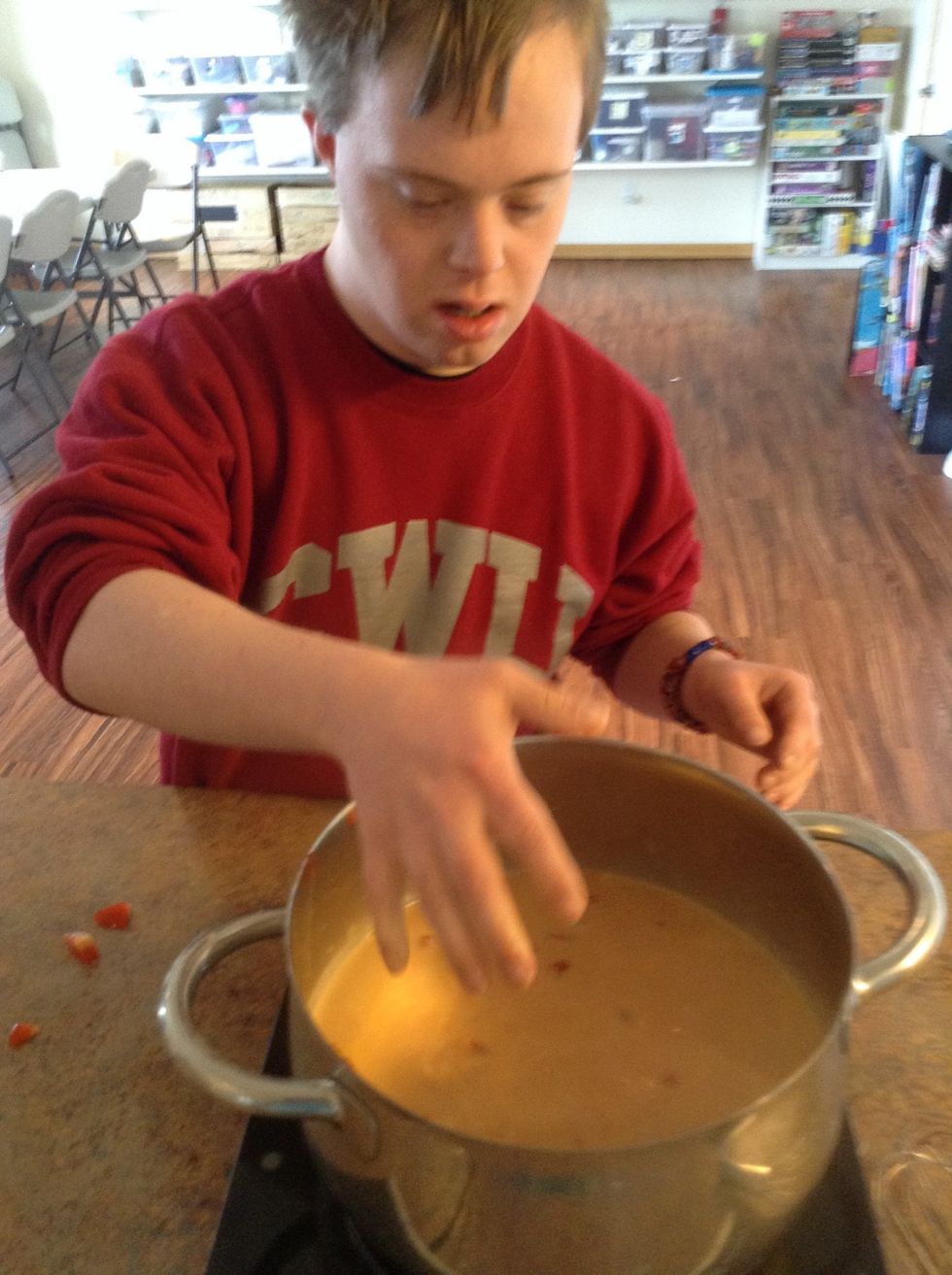 Add red peppers to pot