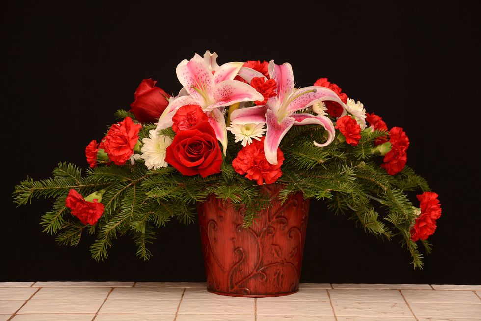 Add red roses as shown. Additional red roses can be placed on the other side of the arrangement\u2026(or some white ones!) Nice!