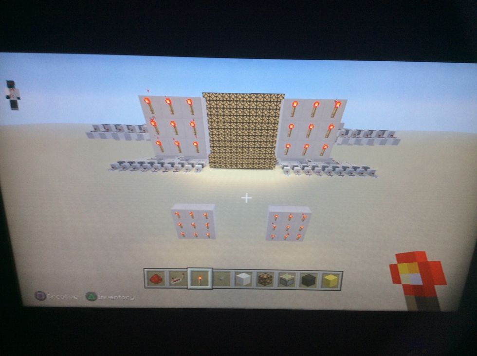 Add redstone torches to the backs of the pads.