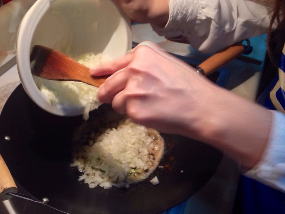 Add remaining 2 tablespoon butter to pan (I did it in the wok) When it melts, add onions and stir; cook 5 minutes until softened.