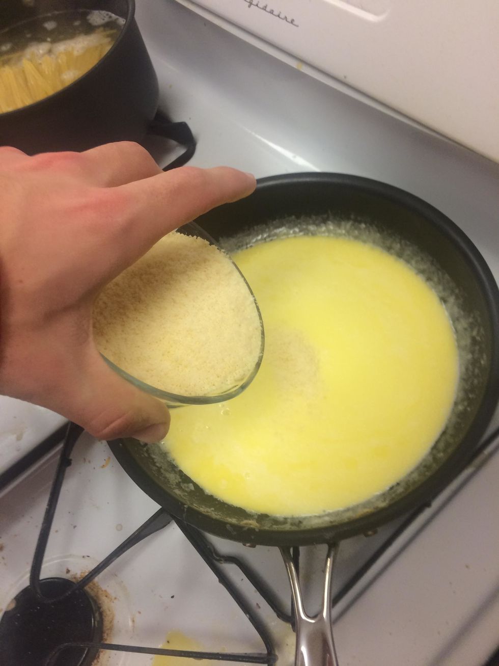 Add remaining Parmesan into butter and cream mixture and stir