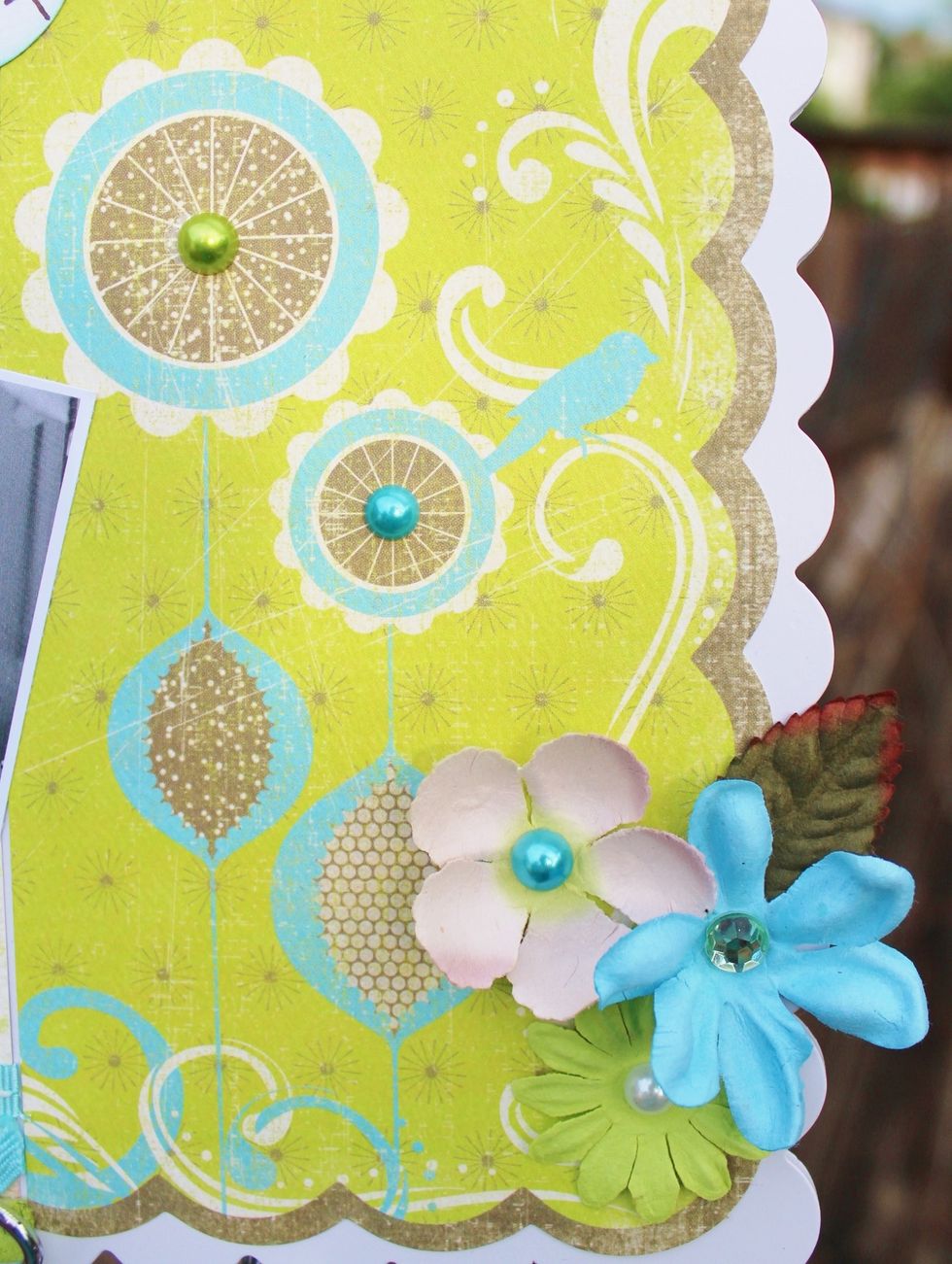 add rhinestones to printed paper on right side and to flower centers. you could also embellish the clip with flowers, ribbons or rhinestones. i was happy with the balance so i didn't.